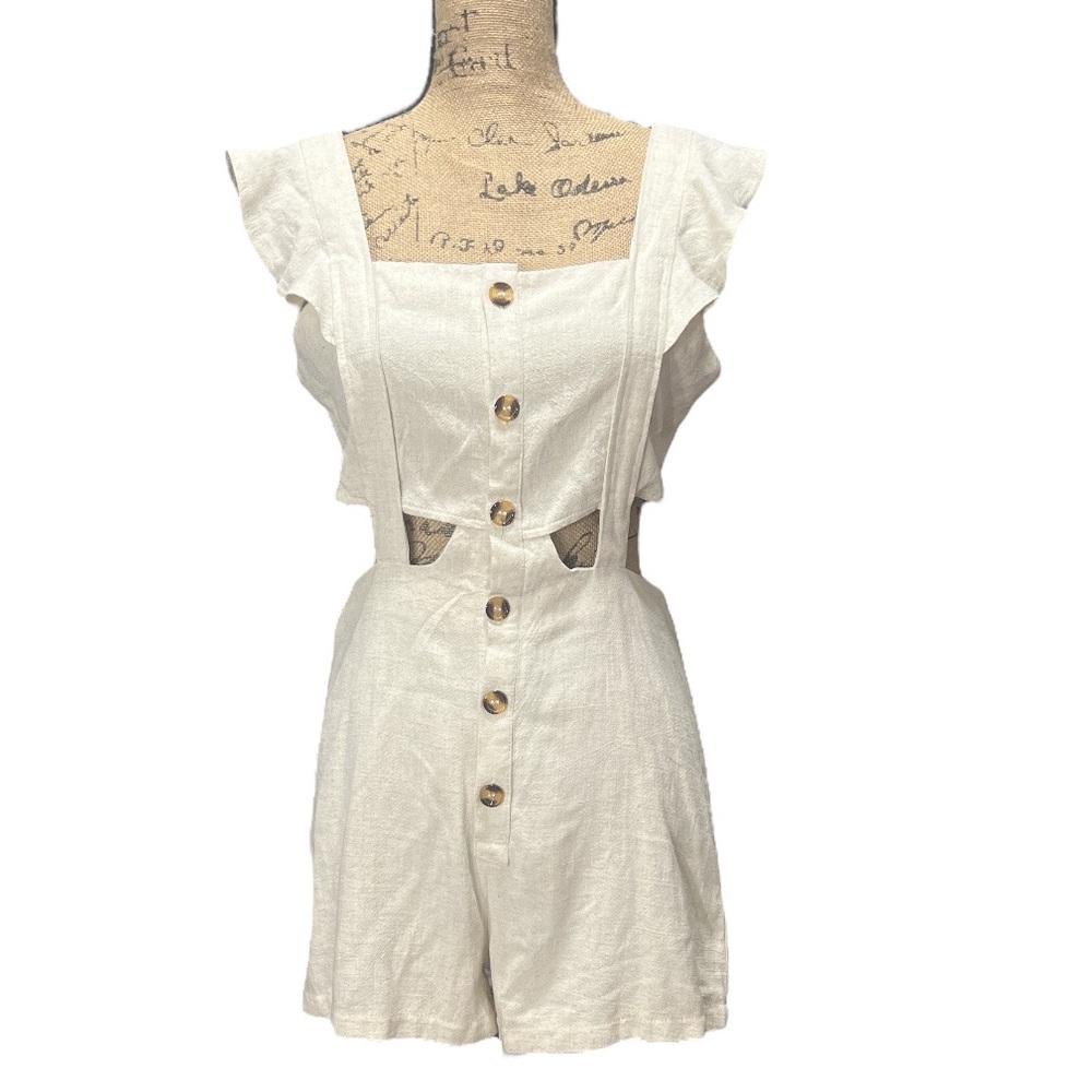 Chic me EC cream-colored romper with ruffle sleeves and button details. Medium